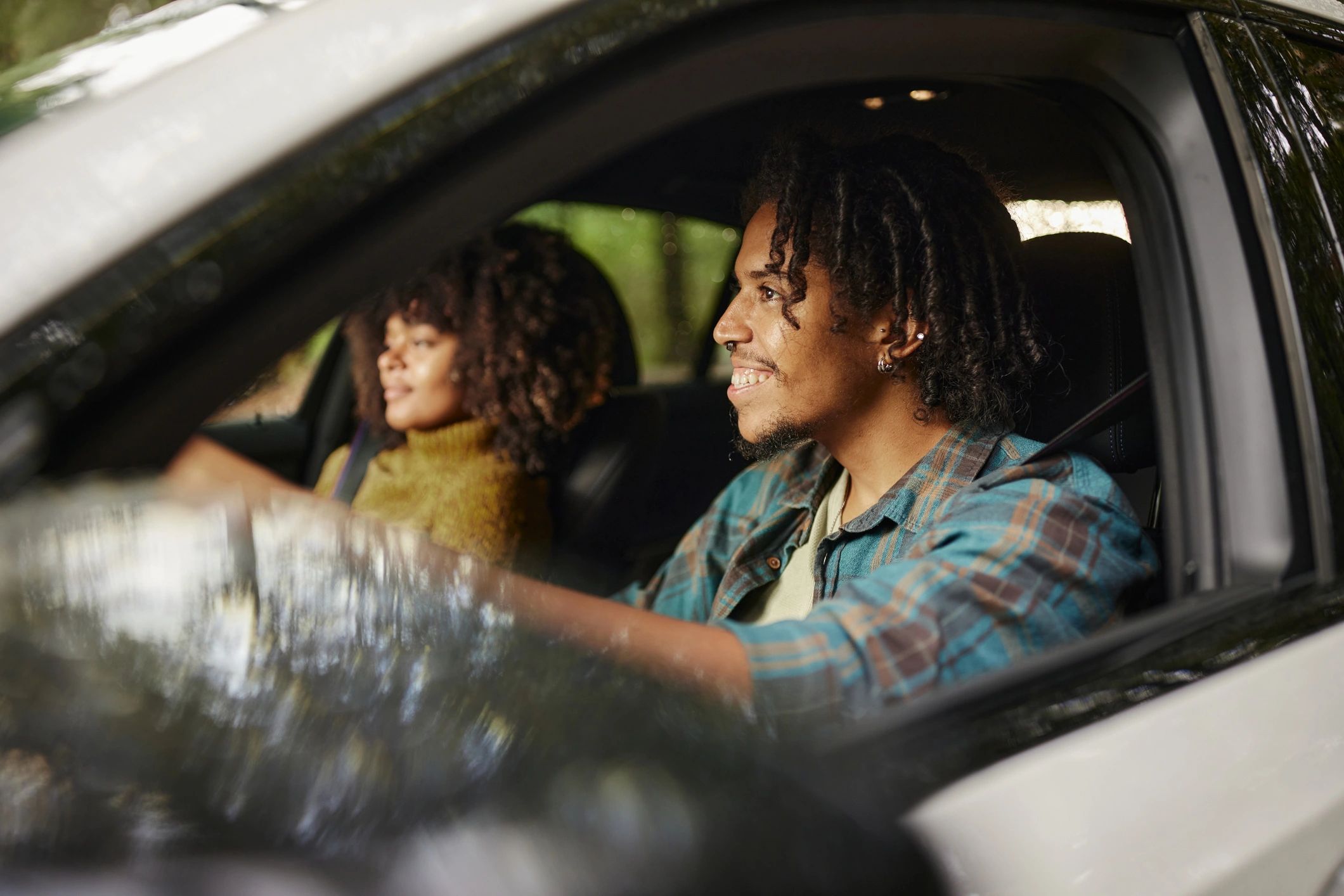 Couple riding in a car on a road trip