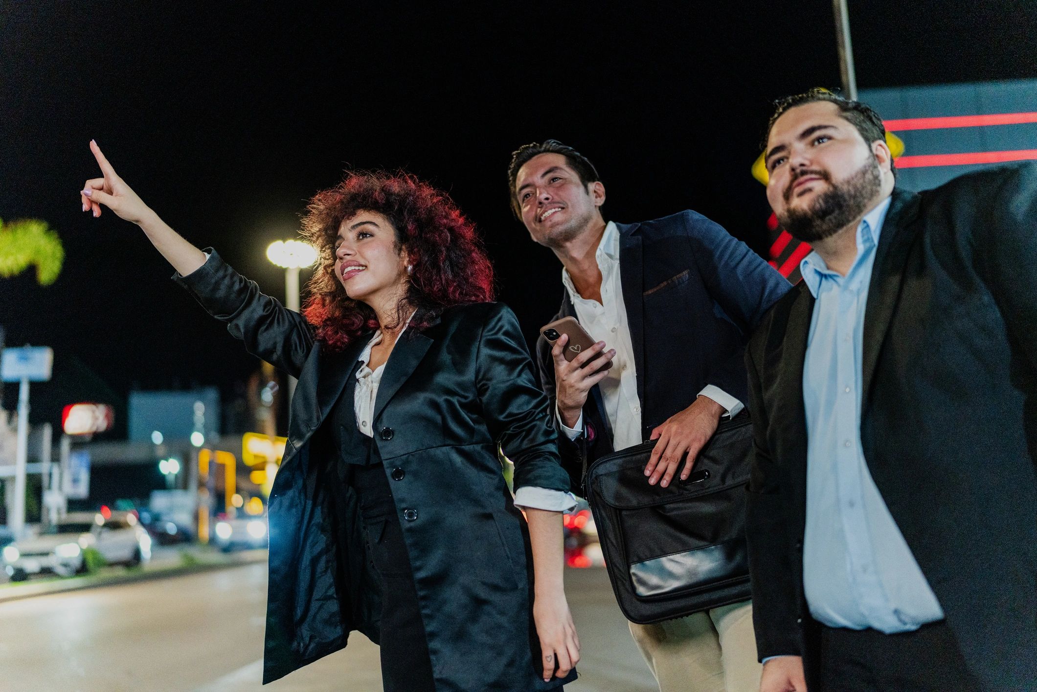 Group hailing a ride in the city