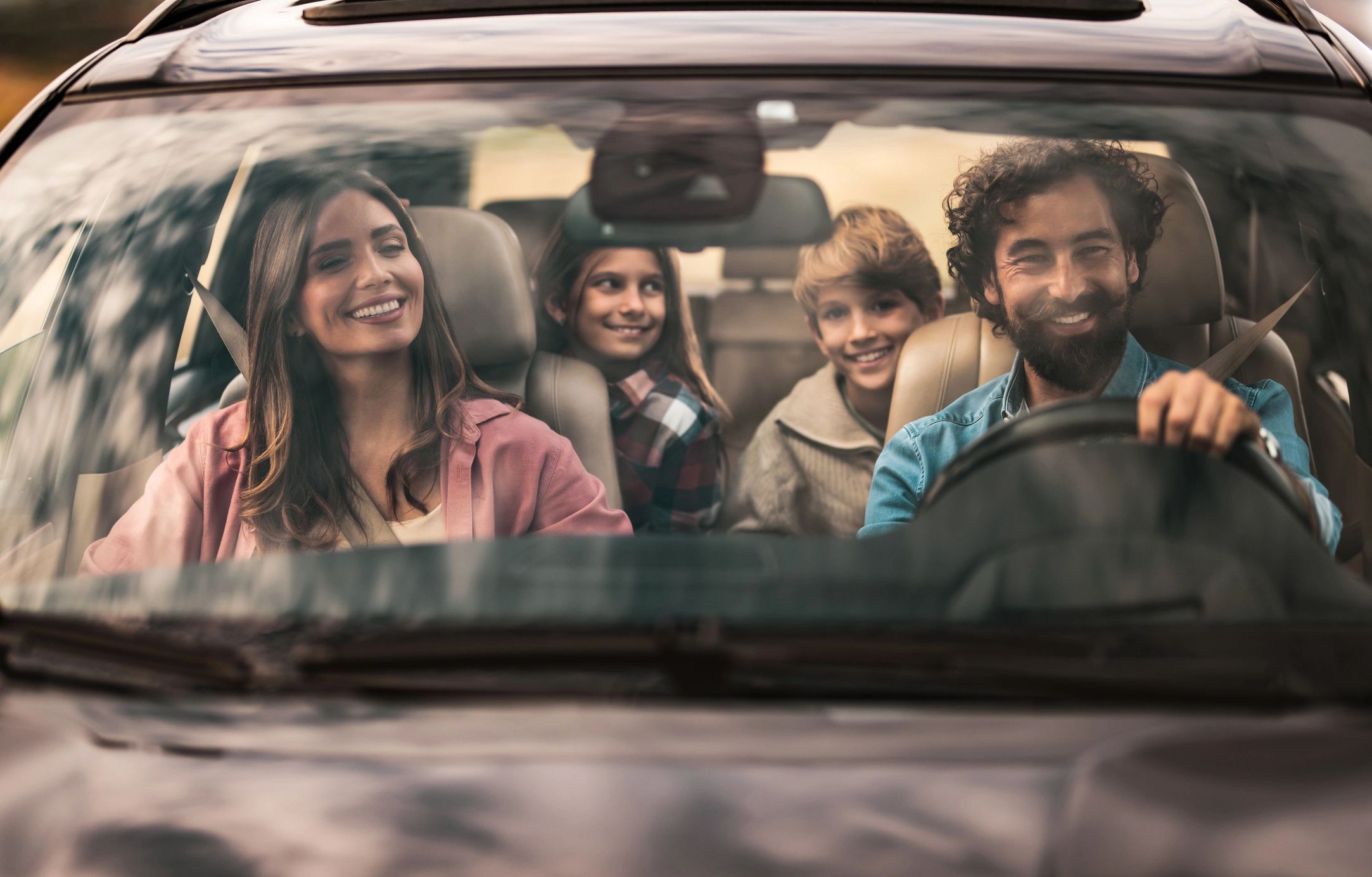 Happy family in a car